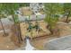Community playground with slides, climbing structures, and swings, surrounded by a safety fence at 2615 Painted Trillium Ct., Myrtle Beach, SC 29579