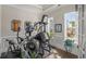 Private workout room with exercise equipment, hardwood floors, large windows, and modern decor at 2615 Painted Trillium Ct., Myrtle Beach, SC 29579