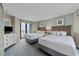 Relaxing bedroom with two beds, balcony access, and calming decor for a peaceful stay at 2701 N Ocean Blvd. # 561/563, Myrtle Beach, SC 29577