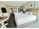 Inviting bedroom with two beds, mini-kitchen, closet, and dresser for comfortable living at 2701 N Ocean Blvd. # 561/563, Myrtle Beach, SC 29577