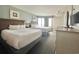 Cozy bedroom with two beds, balcony view, and tv for a relaxing retreat at 2701 N Ocean Blvd. # 561/563, Myrtle Beach, SC 29577