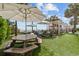 Outdoor picnic area with lawn, picnic table, sun umbrellas, and lounge chairs at 2701 N Ocean Blvd. # 561/563, Myrtle Beach, SC 29577