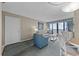 Cozy living room with sofa, chair, and balcony offering ocean views; perfect for relaxation at 2701 N Ocean Blvd. # 561/563, Myrtle Beach, SC 29577