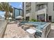 Outdoor patio with fire pit, cushioned seating, and tables outside condos at 2701 N Ocean Blvd. # 561/563, Myrtle Beach, SC 29577