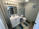 Well-lit bathroom with a modern sink, white cabinets, and neutral tiling at 2701 S Ocean Blvd. # 1507, North Myrtle Beach, SC 29582