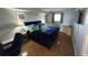 Cozy bedroom featuring hardwood floors, calming colors, and natural light at 2701 S Ocean Blvd. # 1507, North Myrtle Beach, SC 29582