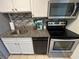 Cozy kitchen with stainless steel appliances, including a stove, microwave and modern backsplash at 2701 S Ocean Blvd. # 1507, North Myrtle Beach, SC 29582