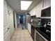 Bright, galley style kitchen featuring stainless steel appliances with an open view through the home at 2701 S Ocean Blvd. # 1507, North Myrtle Beach, SC 29582