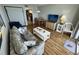 Cozy living room with comfortable seating, a TV, and views into the kitchen for easy entertaining at 2701 S Ocean Blvd. # 1507, North Myrtle Beach, SC 29582