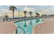 Outdoor pool with palm trees and many lounge chairs for residents at 2701 S Ocean Blvd. # 1507, North Myrtle Beach, SC 29582