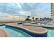 Outdoor pool with a uniquely shaped walkway for relaxation at 2701 S Ocean Blvd. # 1507, North Myrtle Beach, SC 29582