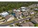 Beautiful aerial view of a home in a landscaped community with a lake and mature trees at 320 Saint Catherine Bay Ct., Surfside Beach, SC 29575