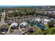 Charming aerial view of a community with a pool, lush landscaping, and nearby marsh at 320 Saint Catherine Bay Ct., Surfside Beach, SC 29575