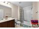 Well-lit bathroom with a shower-tub combo, single sink vanity and neutral wall color at 320 Saint Catherine Bay Ct., Surfside Beach, SC 29575