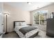 Comfortable bedroom with large window overlooking the lush greenery at 320 Saint Catherine Bay Ct., Surfside Beach, SC 29575