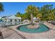 An in-ground pool featuring a lazy river, palm trees, and many seating options at 320 Saint Catherine Bay Ct., Surfside Beach, SC 29575