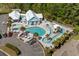 Aerial view of an exclusive community pool with lazy river, seating, and lush surroundings at 320 Saint Catherine Bay Ct., Surfside Beach, SC 29575