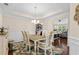 Elegant dining room featuring a tray ceiling, wood floors, and stylish furnishings at 320 Saint Catherine Bay Ct., Surfside Beach, SC 29575