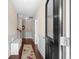 Inviting hallway with wood floors, white wainscoting, and a decorative rug at 320 Saint Catherine Bay Ct., Surfside Beach, SC 29575