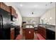 Modern kitchen with stainless steel appliances, granite countertops, hardwood floors, and an island at 320 Saint Catherine Bay Ct., Surfside Beach, SC 29575