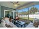 Relaxing sunroom featuring comfortable seating, ceiling fan, and view of the yard at 320 Saint Catherine Bay Ct., Surfside Beach, SC 29575