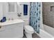 White bathroom with a tub and shower combination, and a large mirror at 333 14Th Ave. S, Surfside Beach, SC 29575