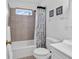 Clean bathroom with a tiled shower, sink, and toilet, with natural light at 333 14Th Ave. S, Surfside Beach, SC 29575