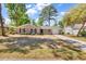 Charming brick home with black shutters, a well-manicured lawn, and a cozy front porch at 333 14Th Ave. S, Surfside Beach, SC 29575