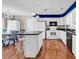Well-equipped kitchen with stainless steel appliances, a kitchen island, and an adjacent dining area at 333 14Th Ave. S, Surfside Beach, SC 29575