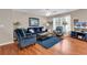 Cozy living room with plush furniture, hardwood floors, and natural light from a large window at 333 14Th Ave. S, Surfside Beach, SC 29575