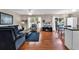 Stylish living room featuring hardwood floors, an entertainment center, and a dining area at 333 14Th Ave. S, Surfside Beach, SC 29575