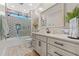 Bright bathroom featuring modern fixtures, tiled shower, and a vanity with ample storage space at 355 Oak Ave., Murrells Inlet, SC 29576