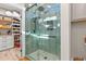 Elegant bathroom showing a glass shower enclosure with tile surround, overhead lighting, and storage at 355 Oak Ave., Murrells Inlet, SC 29576