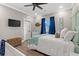 Well-lit bedroom features a crib, dresser, ceiling fan and rustic, coastal decorations at 355 Oak Ave., Murrells Inlet, SC 29576