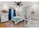 Tranquil bedroom with wooden accents, a comfortable bed, and natural light, perfect for relaxation at 355 Oak Ave., Murrells Inlet, SC 29576