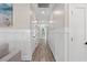 Bright hallway with hardwood floors and white wainscoting at 355 Oak Ave., Murrells Inlet, SC 29576