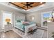 Cozy main bedroom featuring a wood-paneled ceiling, a large bed, and great natural light at 355 Oak Ave., Murrells Inlet, SC 29576