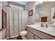 This bathroom features a functional sink, toilet, and shower with a patterned curtain at 377 Copperwood Loop, Conway, SC 29526