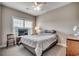 Well lit bedroom featuring a large window, wood furniture, and comfortable bedding at 377 Copperwood Loop, Conway, SC 29526