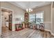 Traditional dining room with hardwood floors, display cabinet, and a view of the backyard at 377 Copperwood Loop, Conway, SC 29526