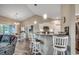 Bright, modern kitchen with white cabinetry, stainless steel appliances, granite countertops, and an adjacent dining area at 377 Copperwood Loop, Conway, SC 29526