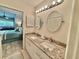 Bathroom with double sinks, granite countertops, and views into the main bedroom at 421 Appledore Circle # 5-D, Myrtle Beach, SC 29572