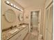 Bathroom featuring double sinks, granite counters, and access to the shower and toilet at 421 Appledore Circle # 5-D, Myrtle Beach, SC 29572
