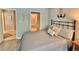 Bedroom view showcasing nautical themed decor and a partial view of the en-suite bathroom at 421 Appledore Circle # 5-D, Myrtle Beach, SC 29572