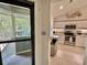 View into the kitchen with stainless steel appliances, granite countertops and access to screened porch at 421 Appledore Circle # 5-D, Myrtle Beach, SC 29572