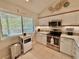 Well-lit kitchen with stainless steel appliances and granite countertops under decorative art at 421 Appledore Circle # 5-D, Myrtle Beach, SC 29572