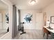 Versatile room features workout bike and desk, ideal for exercise or work with great natural light and calming art at 4344 Falls Oaks St., Myrtle Beach, SC 29579