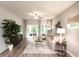Cozy living room with modern furniture, large windows, and access to an outdoor patio at 4344 Falls Oaks St., Myrtle Beach, SC 29579