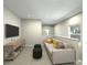 Cozy bonus room featuring comfortable seating, a TV, and natural light, offering a versatile space for relaxation and entertainment at 4349 Falls Oaks St., Myrtle Beach, SC 29579