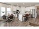 Well-lit kitchen features an island, stainless steel appliances, and an adjacent dining area at 4360 Falls Oaks St., Myrtle Beach, SC 29579